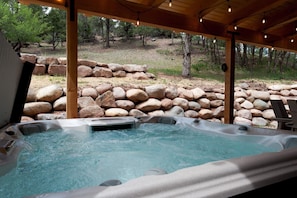 Private, covered hot tub on the outdoor patio.