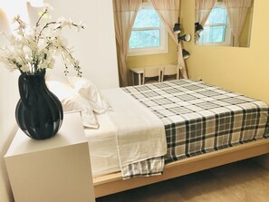 Second bedroom with a queen size bed and a fold sofa bed