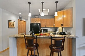 Indoors, Kitchen, Refrigerator, Kitchen Island, Chair