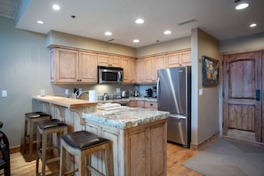 Room, Indoors, Furniture, Kitchen Island, Refrigerator