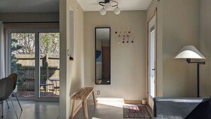 Entry  and dining area with sliding door connecting to guests' private patio. 