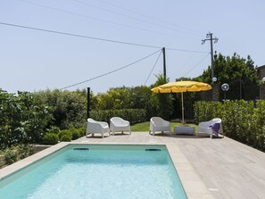 Water, Plant, Property, Sky, Swimming Pool, Shade, Umbrella, Outdoor Furniture, Building, Grass