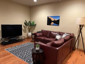 Living room with 60 inch smart TV.