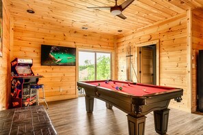 Our game room has arcades, smart TV, and pool table!
