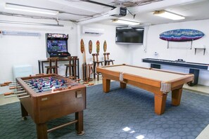 Game room stocked with plenty of fun stuff to do. Pool, mini shuffle board, foosball, and an arcade with 10,000+ games.