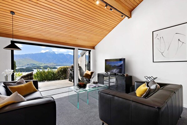 Living Room: Stunning vistas await from this stylish haven, featuring sleek furnishings and modern decor!