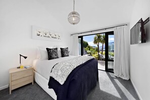 Master Bedroom: Breathtaking views await from your private terrace in this elegantly decorated retreat!