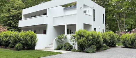 Newly renovated contemporary home with mature landscaping, large driveway.