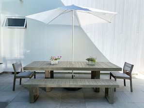 Outdoor table seats 8-10.