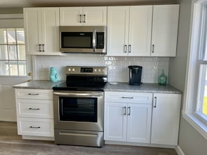 New white shaker cabinets with subway tile backsplash