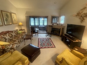 Living Room/sliding glass door to enclosed porch.