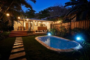 Our garden and pool at night time