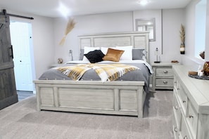 The master bedroom boasts a luxurious ensuite and a spacious king bed.