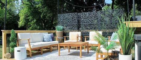 Ideal for gatherings or meals outside, the patio comfortably accommodates 8