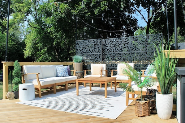 Ideal for gatherings or meals outside, the patio comfortably accommodates 8