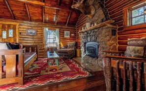 Stone fireplace with gas insert for cooler nights.