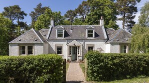 Pirnie Cottage - pretty cottage exterior with gated entrance into the garden