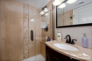 Enjoy the convenience of provided toiletries and towels in all of our bathrooms, two of which feature walk-in glass door showers