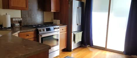 Kitchen with Prosumer appliances, cherry wood cabinets