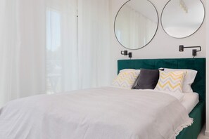 The elegant living area featuring a double bed.