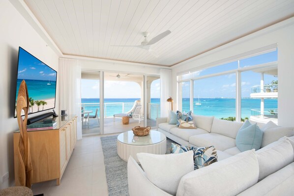 Living Area with sectional views and large windows for natural sunlight.