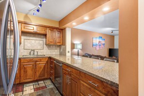 Resort Plaza 5024's kitchen with breakfast bar.