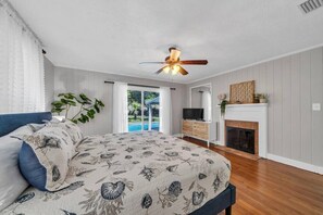 Primary king bedroom with direct access to the pool and backyard 