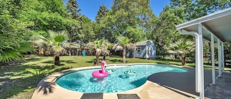 Catch all the rays in this beautiful private backyard, large pool, and play set!