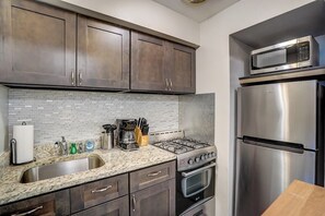 Kitchen with table for extra counter space.