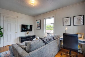 Living room with Roku Smart TV and dedicated workspace!