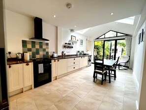 spacious kitchen with french doors to private courtyard