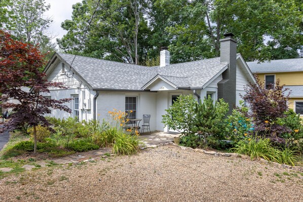 Cottage with gravel parking area
