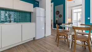 Fully equipped kitchenette for your home cooked meals. The dining area has natural light sources near it #homecooking #naturallight #portugal #pt #lisbon