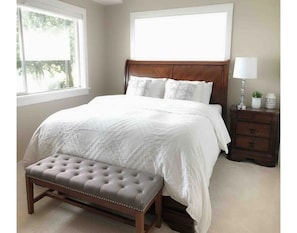 Master Bedroom with King  size Bed it looks out to the Puget Sound & Mountains