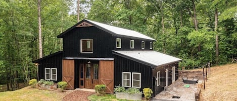 Barndominium styled home built in 2020 set on 3 acres with private creek!