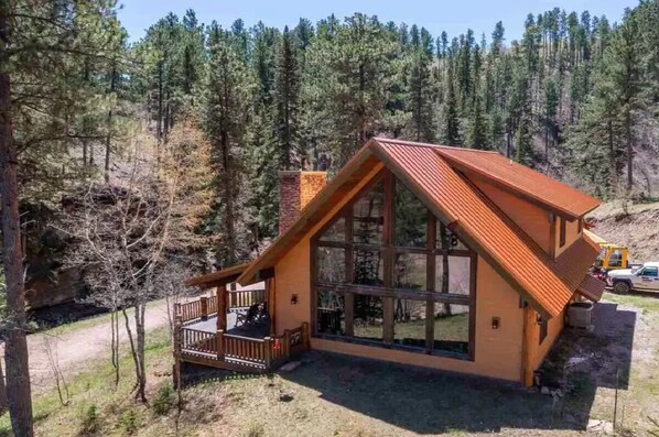 The porch overlooks the creek and a 50' tall rock outcropping!