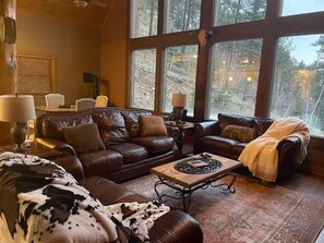 3 leather couches and a recliner in the Living Room