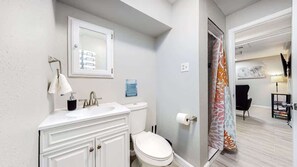 The bathroom is a lovely space, featuring a modern shower that offers both style and comfort. It's a refreshing spot to start your day or unwind after a long one.