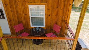 Beautiful custom table with chairs for your morning coffee on the porch