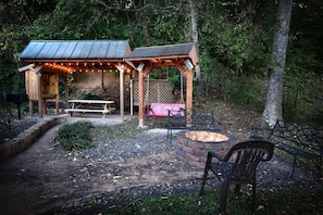 Back yard fire pit and swing at sunset.