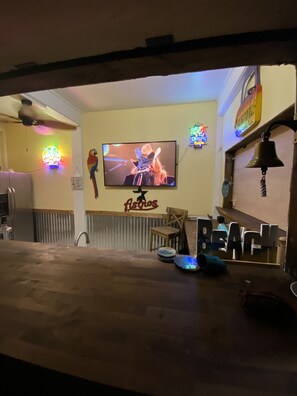 Have movie night outside with the kids or enjoy music videos while you entertain