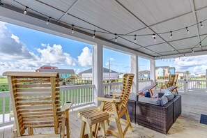 Enjoy the sea breeze & peek-a-boo ocean views from the front balcony . Seats 12+