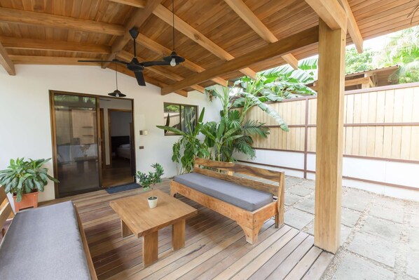 With a fan, lights, and ample outdoor seating, the covered patio is perfect for any time of day no matter the weather