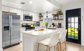 Modern, updated kitchen - fully stocked with space for meal prep or a spread