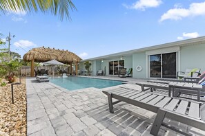 Large beautifully landscaped yard surrounded by privacy fence