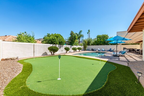 newly installed putting green in backyard