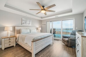 Master Bedroom with King Bed and access to a large balcony.