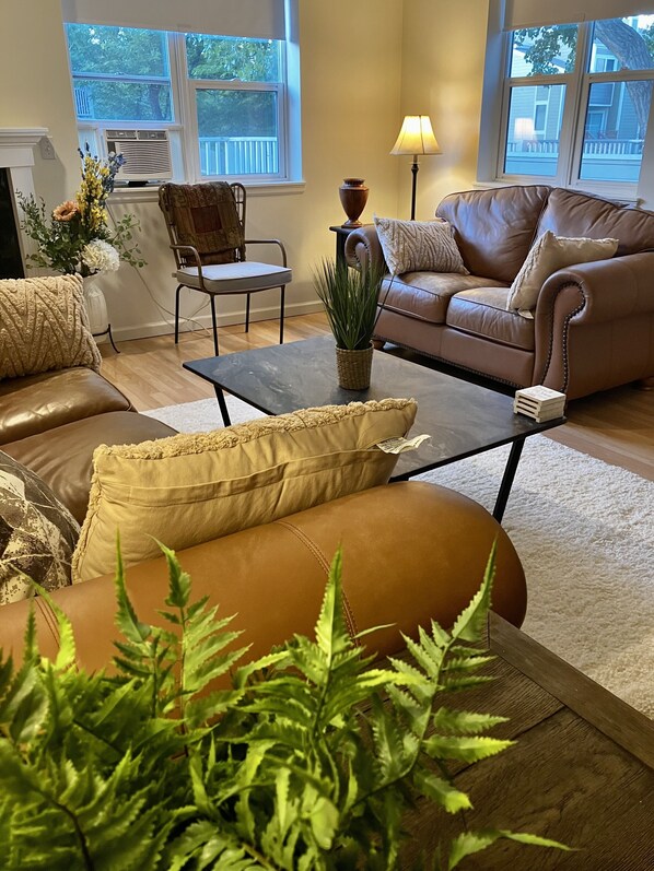 The living area exudes comfort and sunlight.  Come Live The Boulder Life.