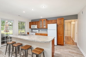 Oversized kitchen with Island seating for four.