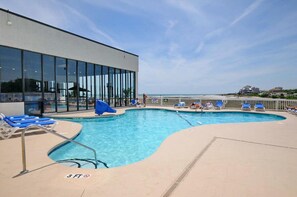 Take a cool dip in the sparkling pool after a fun day at the beach.